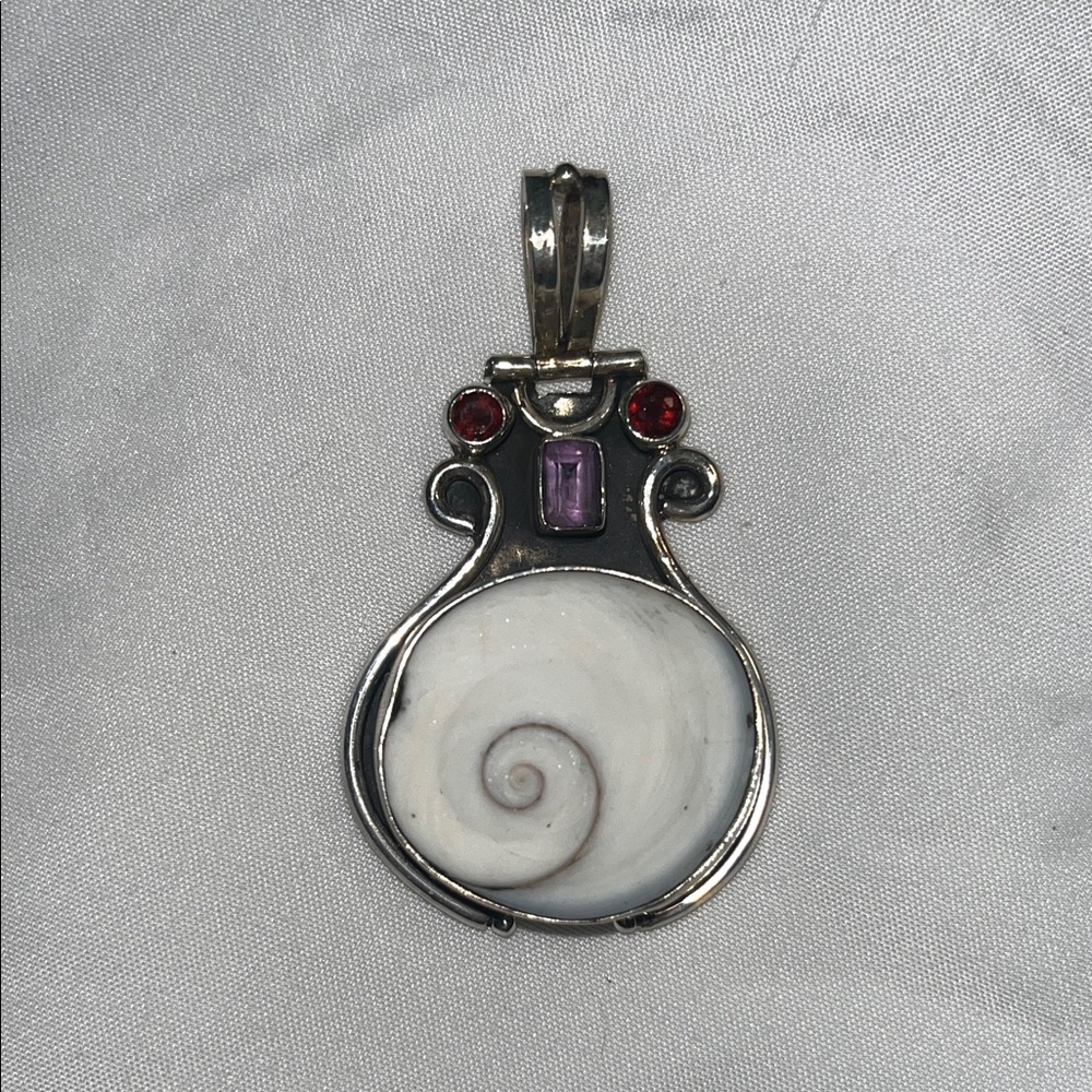 Shiva Shell Pendant set in Silver with Amethyst and Garnet accents